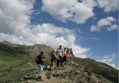 Youth serving on one of Student Conservation Association's National Crews hike to their next hitch