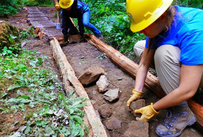 Youth serving on the Student Conservation Association's Regional Crews do trail work in their state park