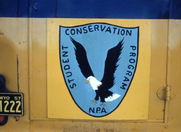 A hand-painted version of the original Student Conservation Association (SCA) logo.