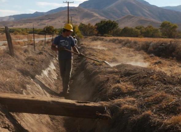 Former conservation volunteer and SCA Leader Crew member Caleb Sanders works on an irrigation ditch as part of a major ecosystem restoration project in California's Southern Sierra Nevadas.