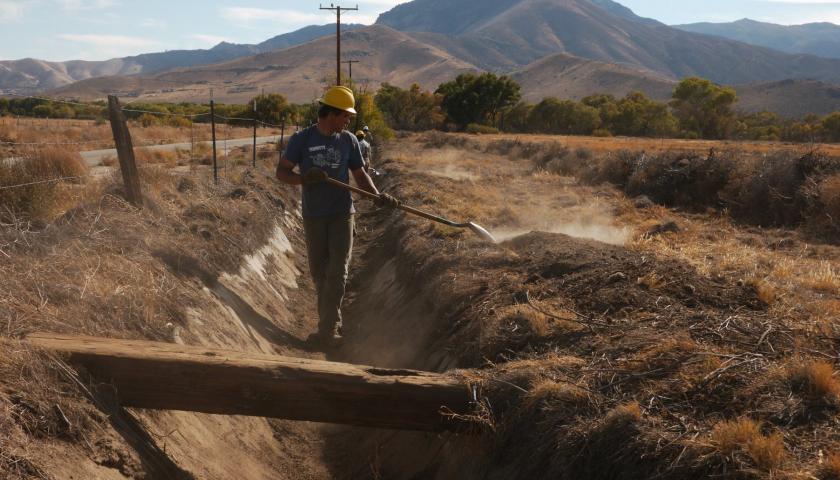 Former conservation volunteer and SCA Leader Crew member Caleb Sanders works on an irrigation ditch as part of a major ecosystem restoration project in California's Southern Sierra Nevadas.