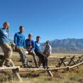 SCA Crew in Chilly Slough Wetlands sitting on the Jack leg fence they just completed.